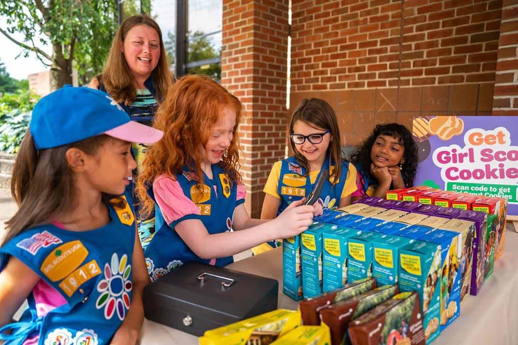 Girl Scouts at a Cookie Booth