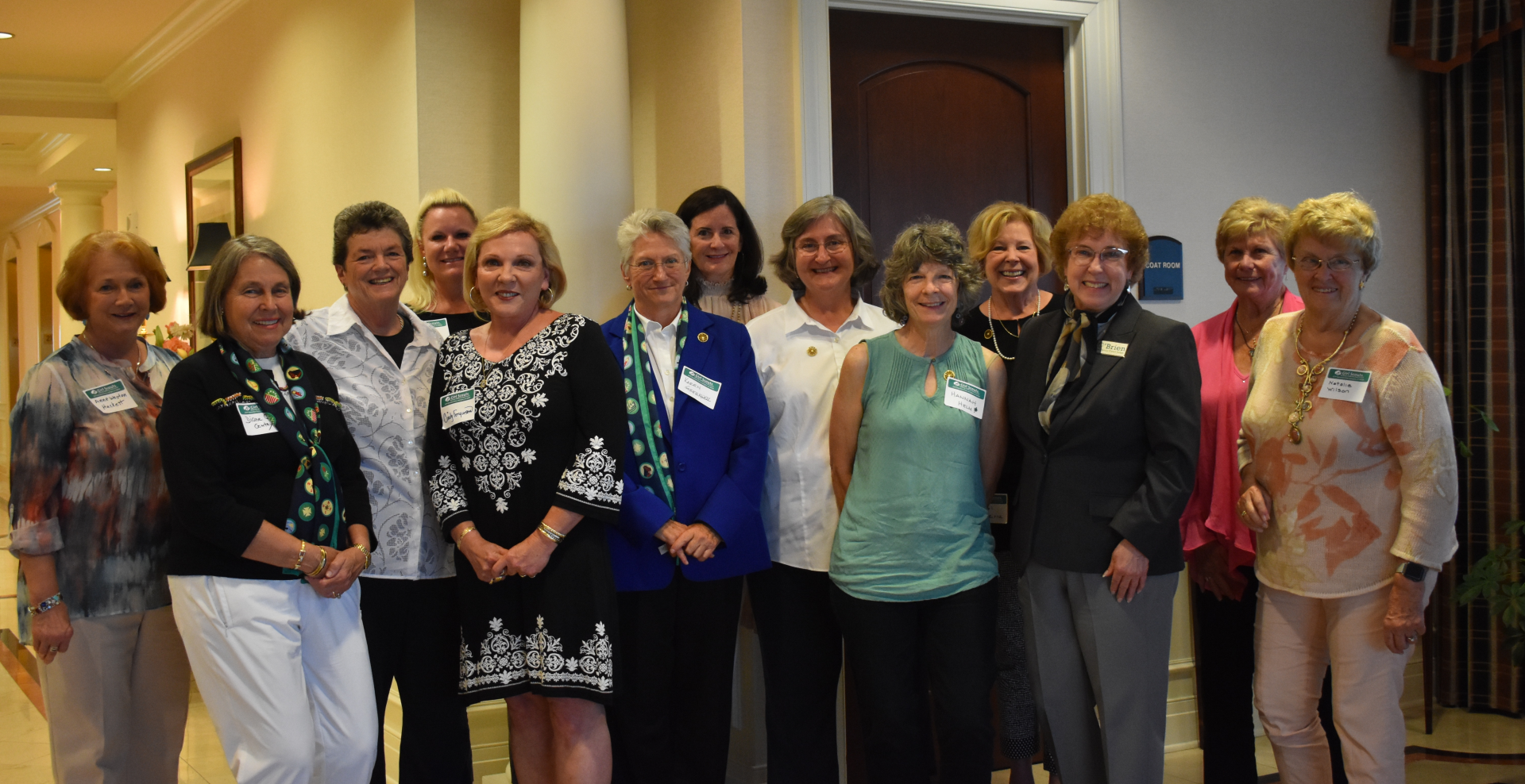  girl scout alum adult women retirement age smiling at camera 